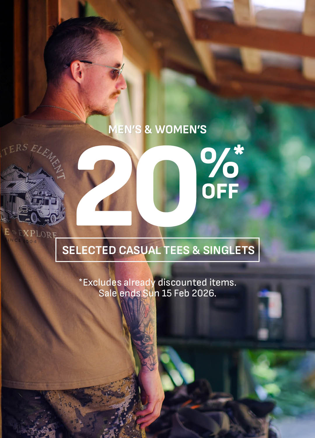 Man wearing a brown t-shirt with a graphic design, standing in an outdoor setting with promotional text overlay.