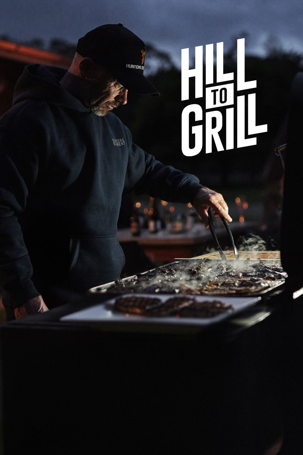 Person grilling outdoors with 'Hill to Grill' branding.